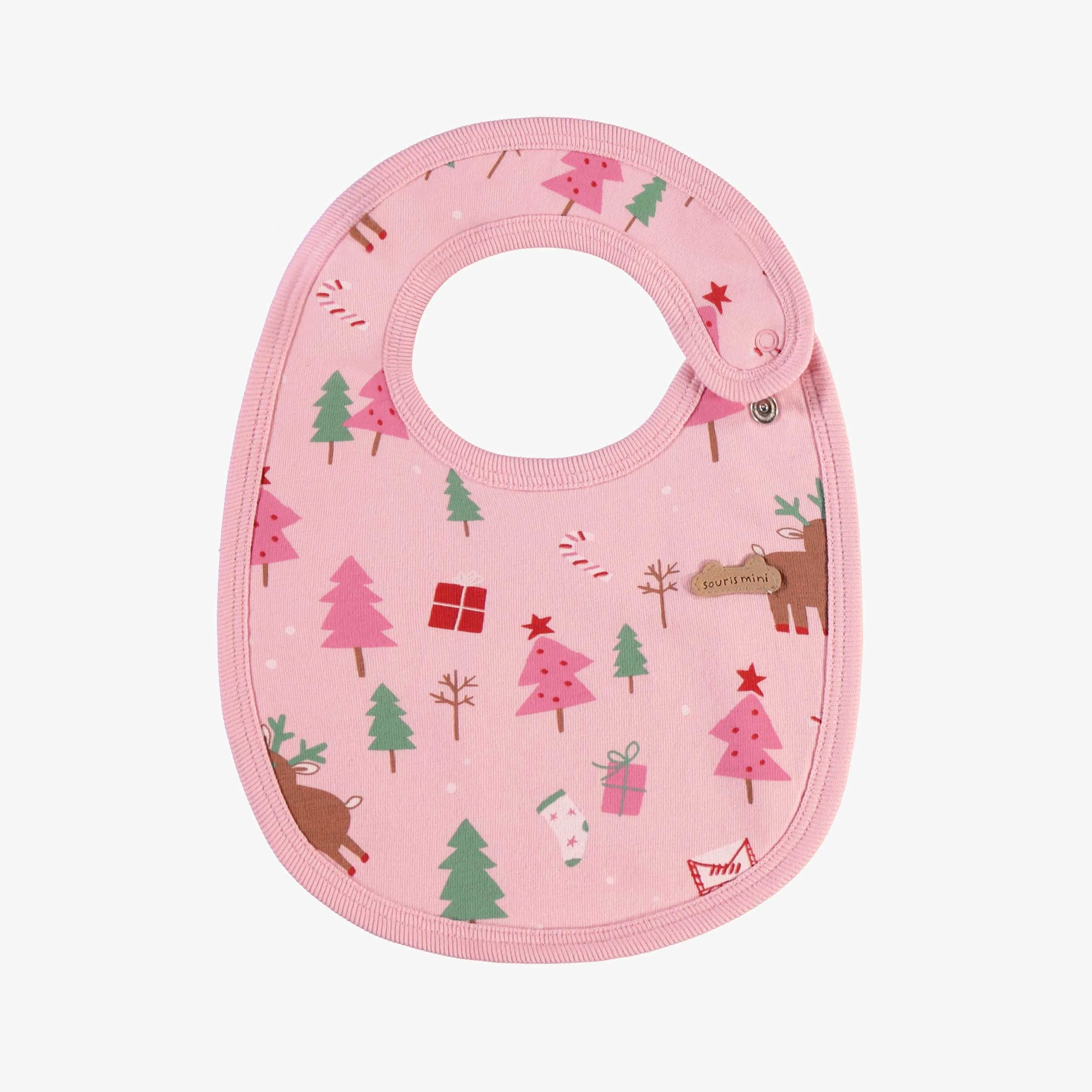 Bavoir rose à motifs des Fêtes, naissance