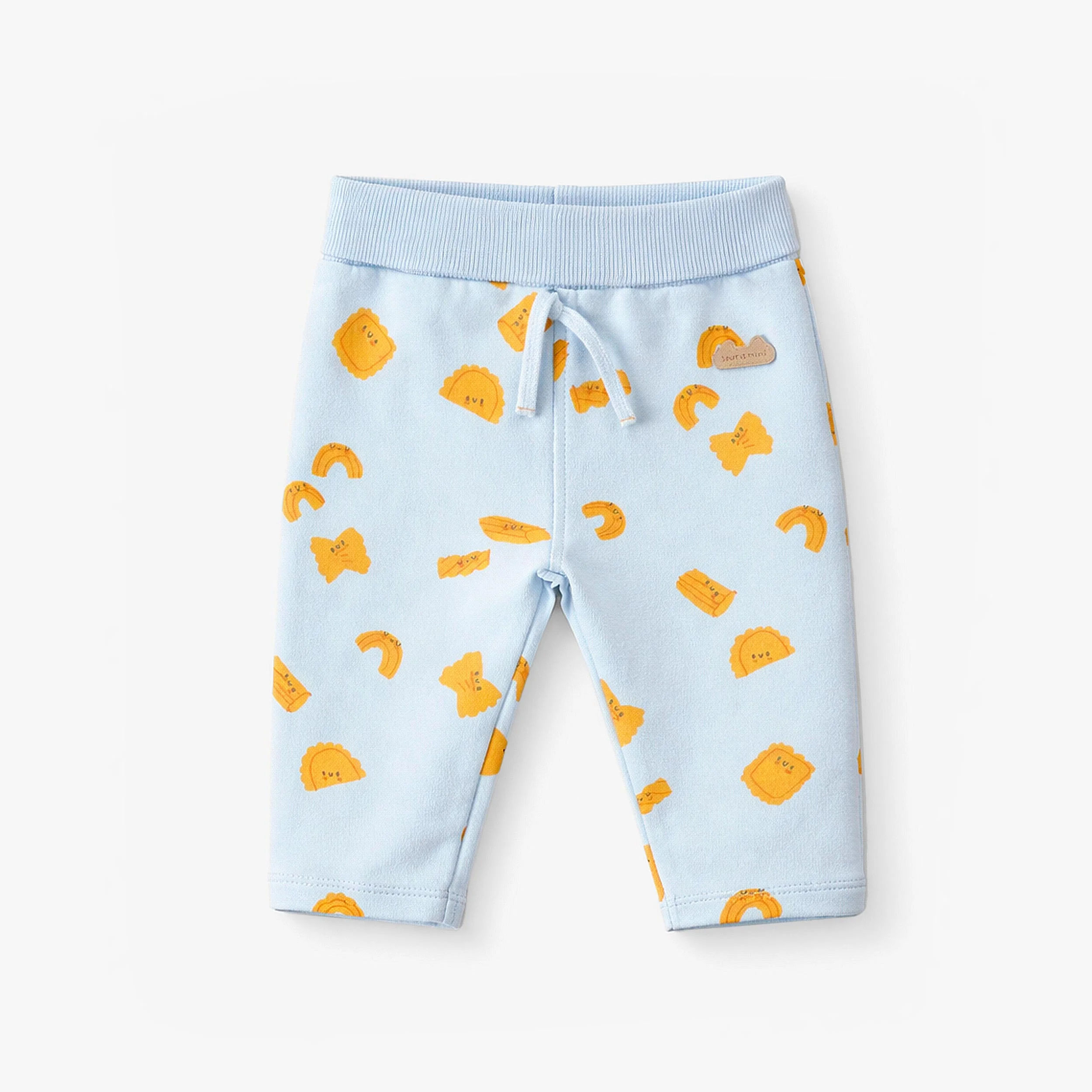 Pantalon bleu à motifs de pâtes, naissance